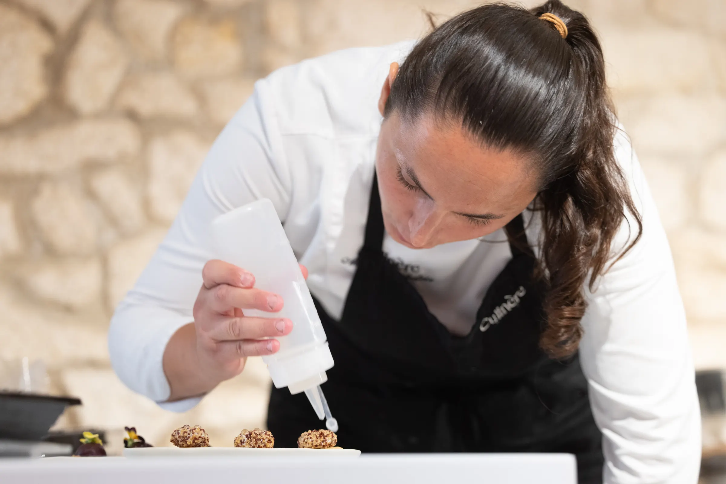 Plating canapés with a pipette in the Culinère kitchen