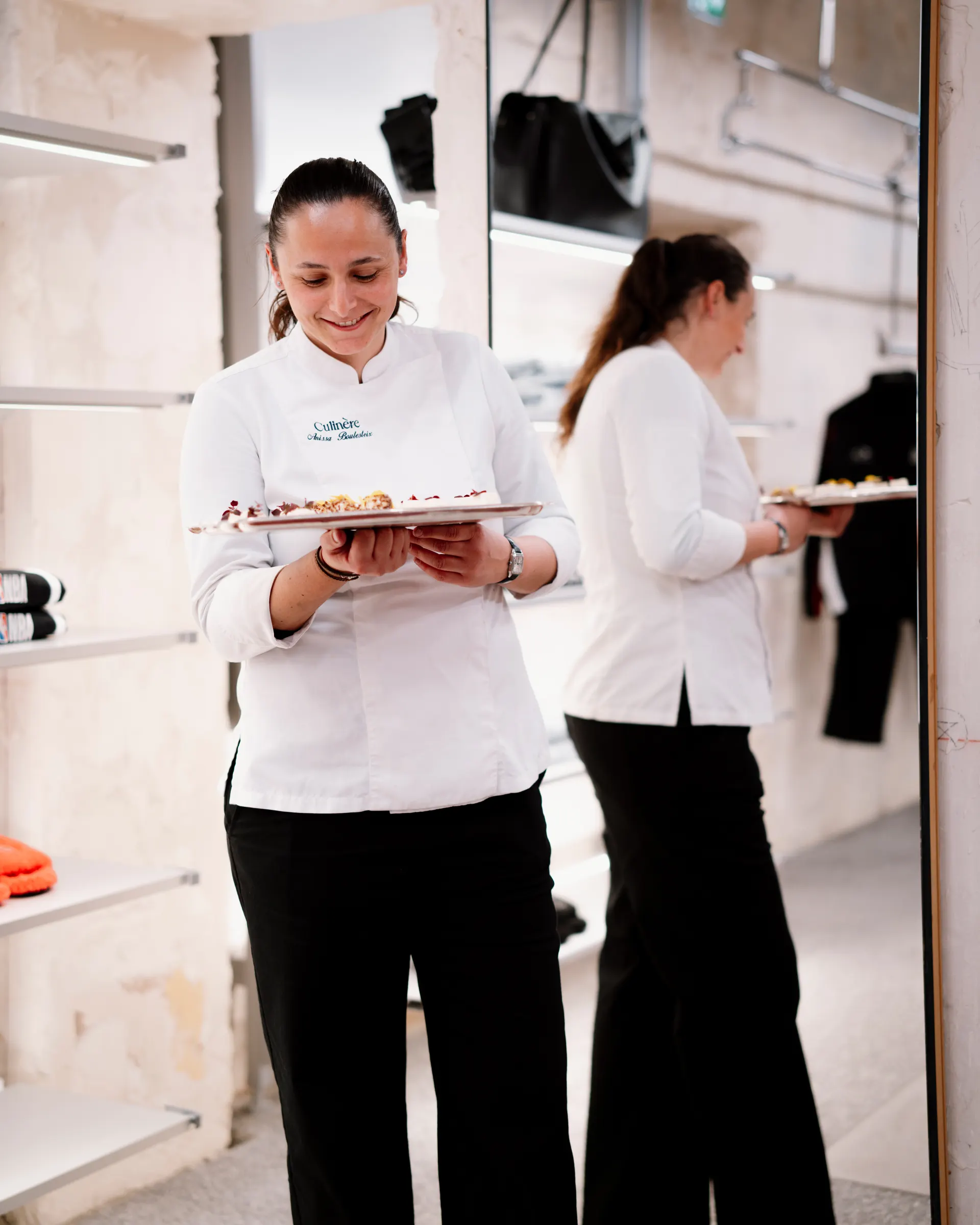 Anissa Boulesteix, chef and founder of Culinère, holding a platter