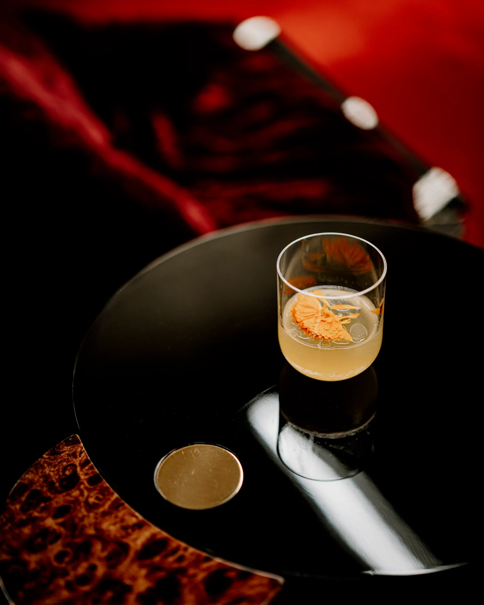 Yellow citrus cocktail served in a coupe