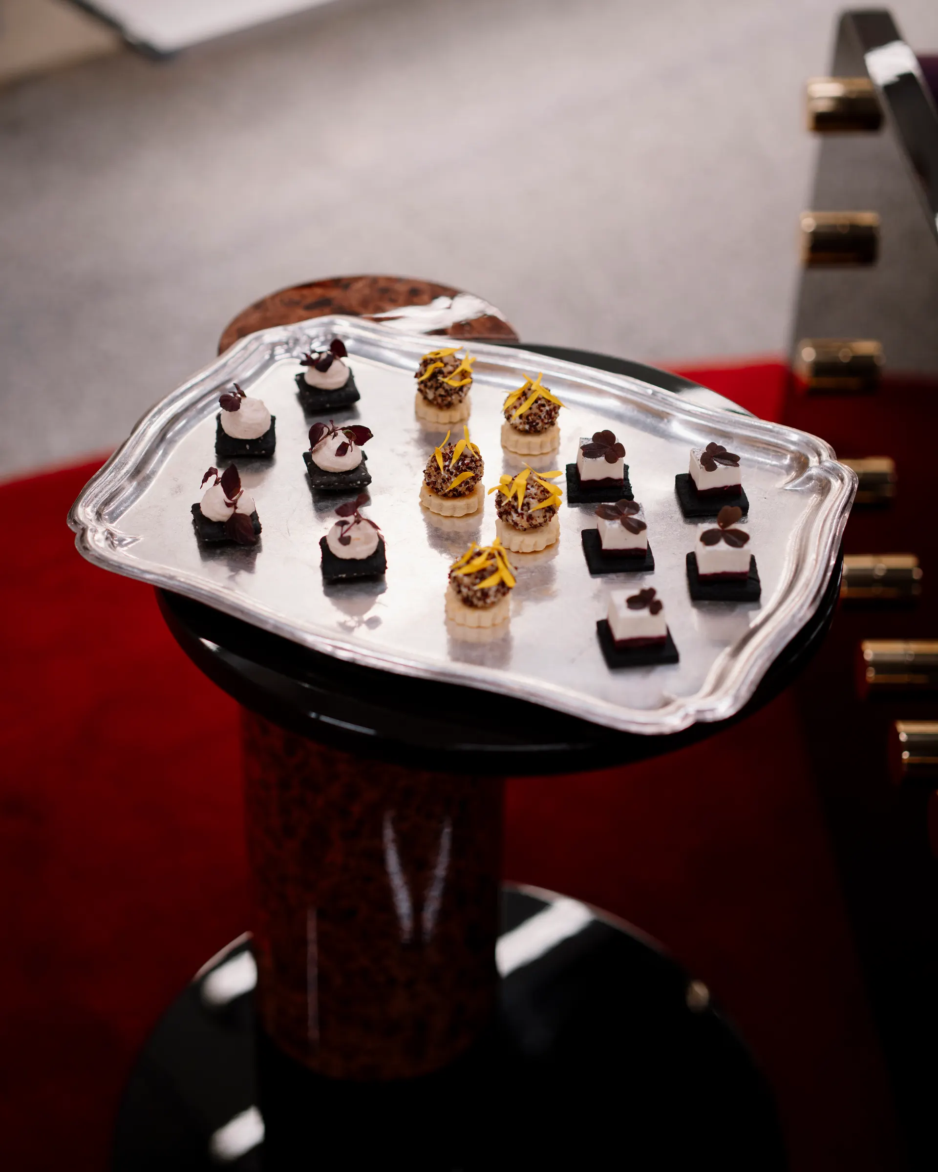 Silver platter of canapés on a pedestal